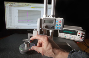 Using the Digital Height Gauge to set the height for a total magnetic flux measurement.